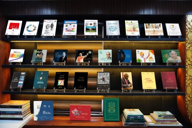 Maneesh Media's published books displayed on illuminated shelves